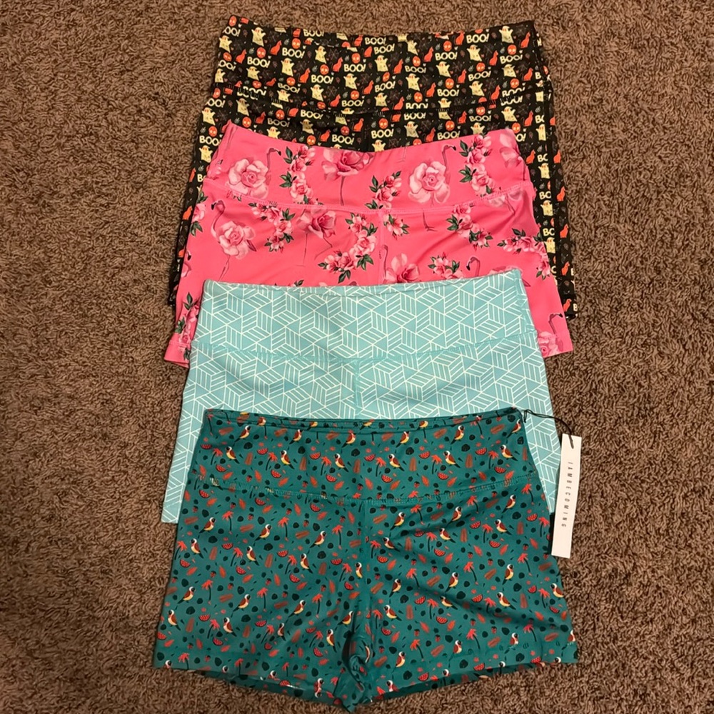 4 pair of IAM Becoming workout shorts. One is new with tags.
